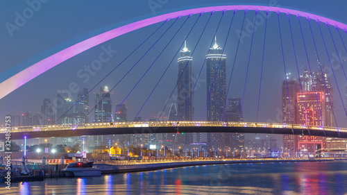 Pedestrian Bridge over the Dubai Water Canal day to night timelapse  United Arab Emirates
