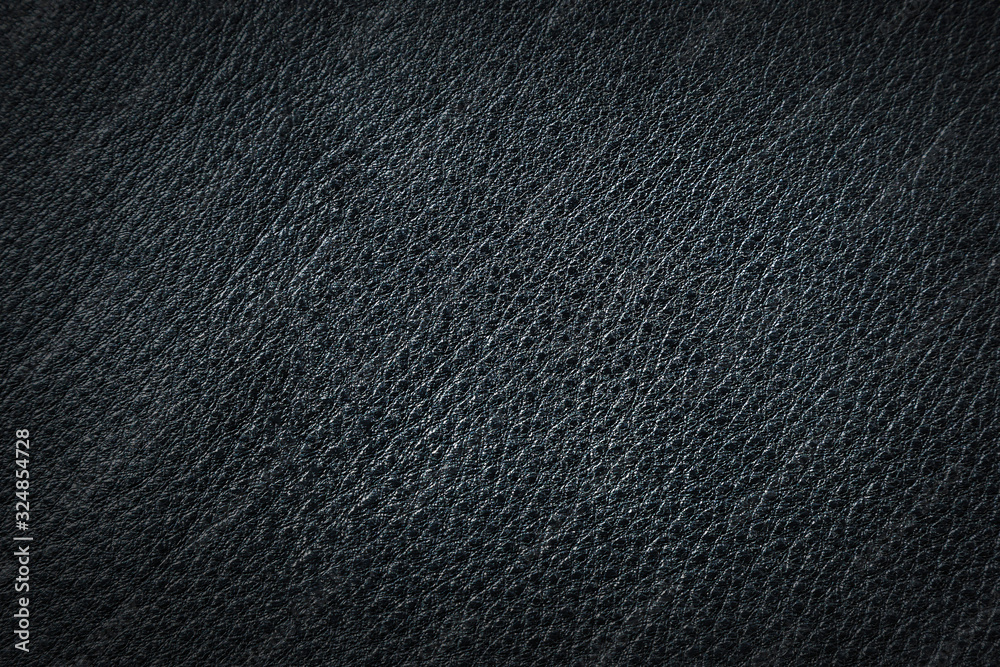 Natural leather black background close up. The structure of the leather product. Natural leather black background close up. The structure of the leather product.