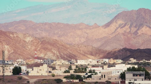 Typical Omani Architecture with Mountains in Background photo