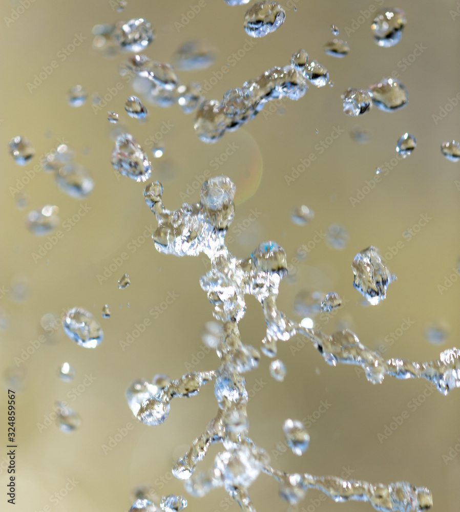 Water splashing from a fountain on summer nature Water splashing from a fountain on summer nature