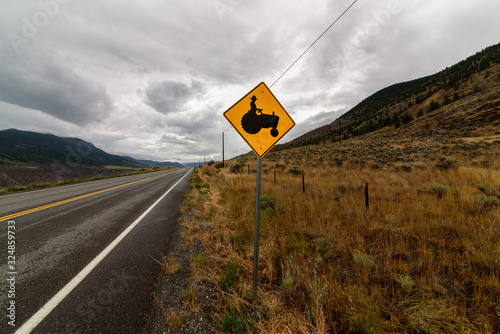 Road to nowhere, attention tractor crossing, North-America, Canada, British Colombia, August 2015