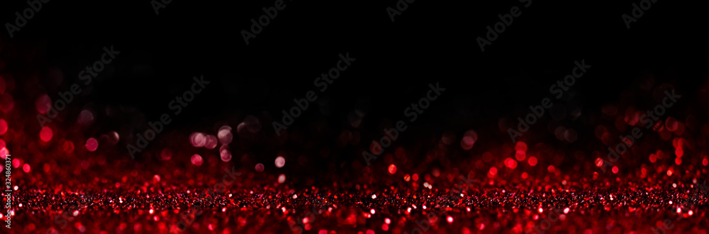 Fotografie Abstract blur red glitter on black background