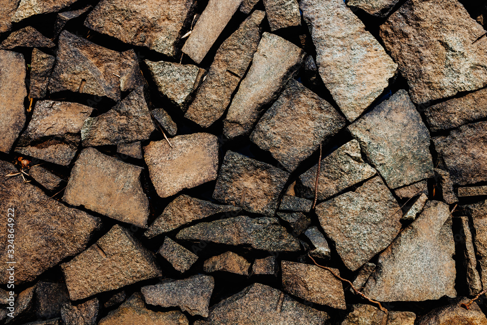 The texture of the stone wall. Background of stone wall. Natural materials The texture of the stone wall. Background of stone wall. Natural materials