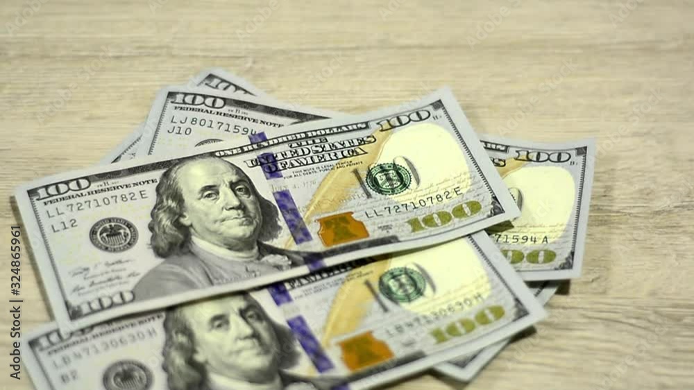 Money, Cash, dollars, a pack falling on the table, macro, clouse-up. Money, Cash, dollars, a pack falling on the table, macro, clouse-up.