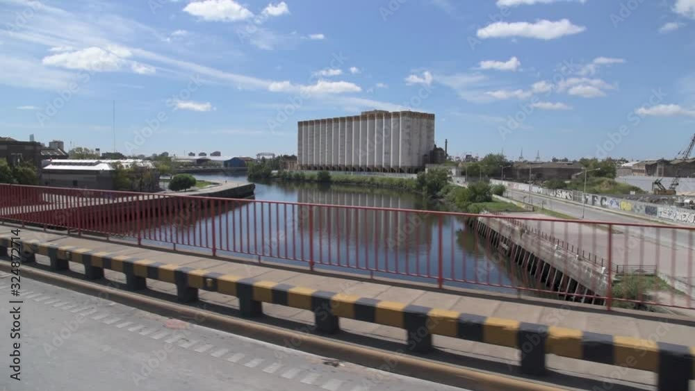 Crossing Pueyrredon bridge from Avellaneda to Capital Federal view of the Riachuelo and silos at the back Crossing Pueyrredon bridge from Avellaneda to Capital Federal view of the Riachuelo and silos at the back