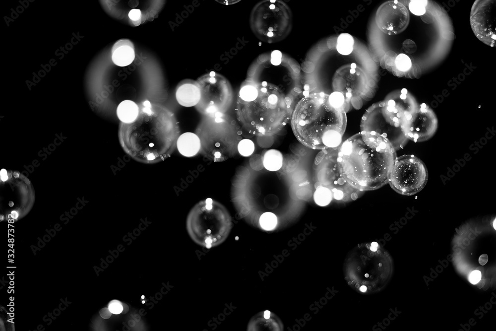 Black and white Abstract Blurred of Bubble on black background, Bokeh with background.