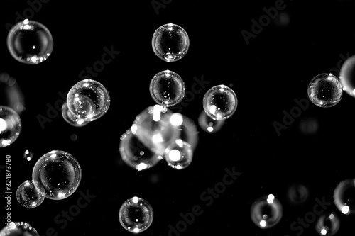 Black and white Abstract Blurred of Bubble on black background, Bokeh with background.