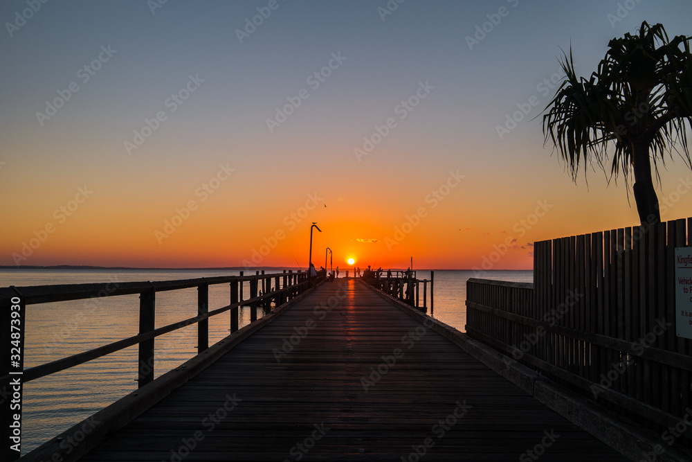 Sunset at pier Fraser Island Australia