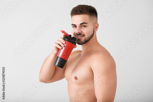Sporty man with protein sha...