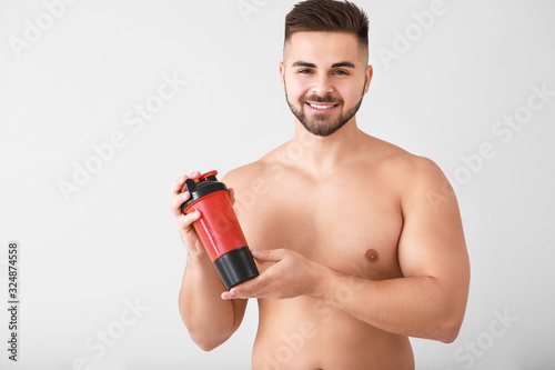 Sporty man with protein sha...