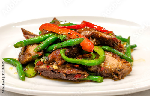  Stir fried duck with basil in long plate ready to serve, Top view.