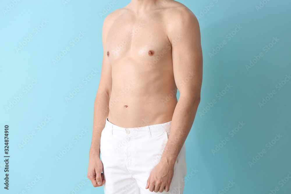 Handsome young man on color background. Plastic surgery concept