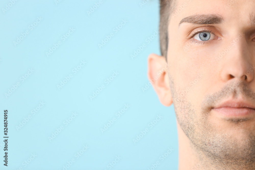 Fototapeta premium Handsome young man on color background, closeup. Plastic surgery concept