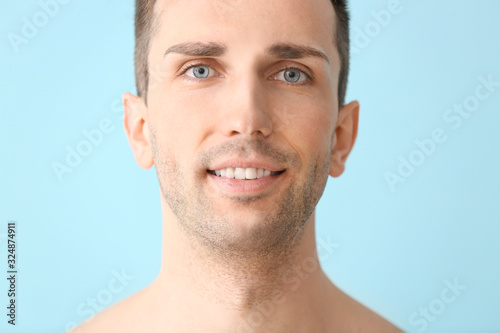 Handsome young man on color...