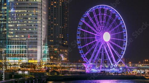 Skycrapers night timelapse and Hong Kong Observation Wheel  which is the latest tourist attraction in the city.