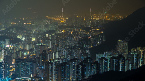 Fei ngo shan Kowloon Peak night timelapse Hong Kong cityscape skyline. photo