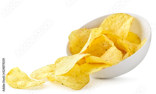 Potato chips with seasonings pour out of the plate on a white. Isolated photo