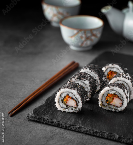 Close up maki sushi rolls with black sesame seeds