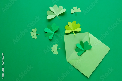 St. Patrick's day, clover on a green shiny background photo