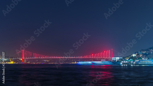 Illuminated bridge over Bosphorus night timelapse. Turkey renames Bosporus Bridge "15th July Martyrs Bridge". Istanbul Turkey. © neiezhmakov