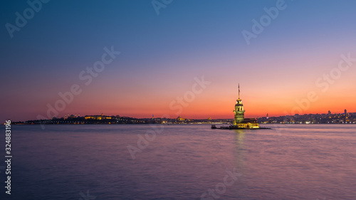 Maidens tower after beautiful sunset day to night timelapse in istanbul, turkey, kiz kulesi tower