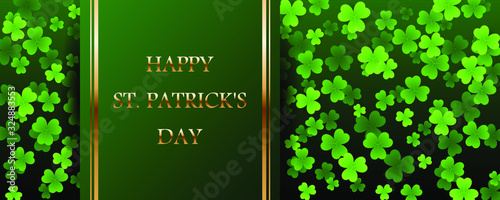 Happy Saint Patricks Day golden text on striped ribbon with clover leaves on green background