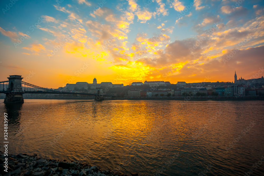 Danube river and historic buildings at sunset in Budapest, Hungary