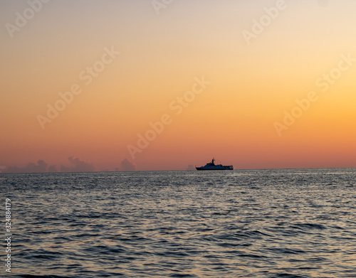 Sunset on the Black Sea of Sochi and a ship on the horizon