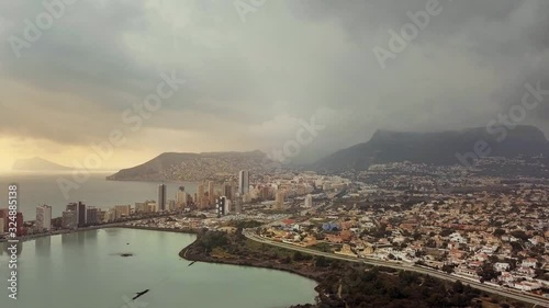 Residential houses in the touristic town of Calp in Alicante Spain. view of the sea, cliffs and mountains, a small bay
