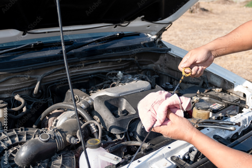 The driver is checking the car before traveling, safety first concept The driver is checking the car before traveling, safety first concept
