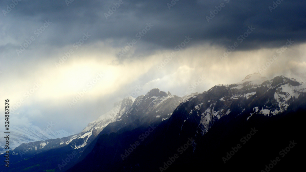 storm approaching alpine mountains
