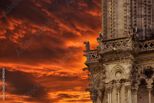 Fire of Notre Dame cathedral in Paris. Close up gargoyles photo