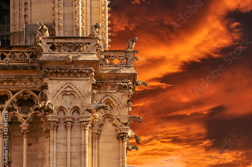 Fire of Notre Dame cathedral in Paris. Close up gargoyles photo