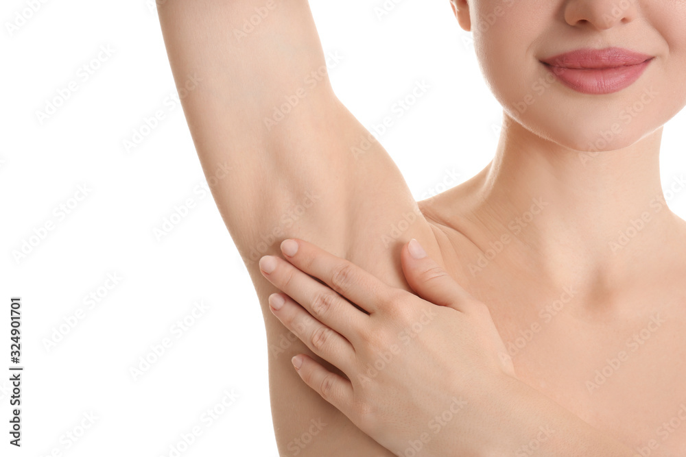 Young beautiful woman showing armpit with smooth clean skin on white background, closeup Young beautiful woman showing armpit with smooth clean skin on white background, closeup