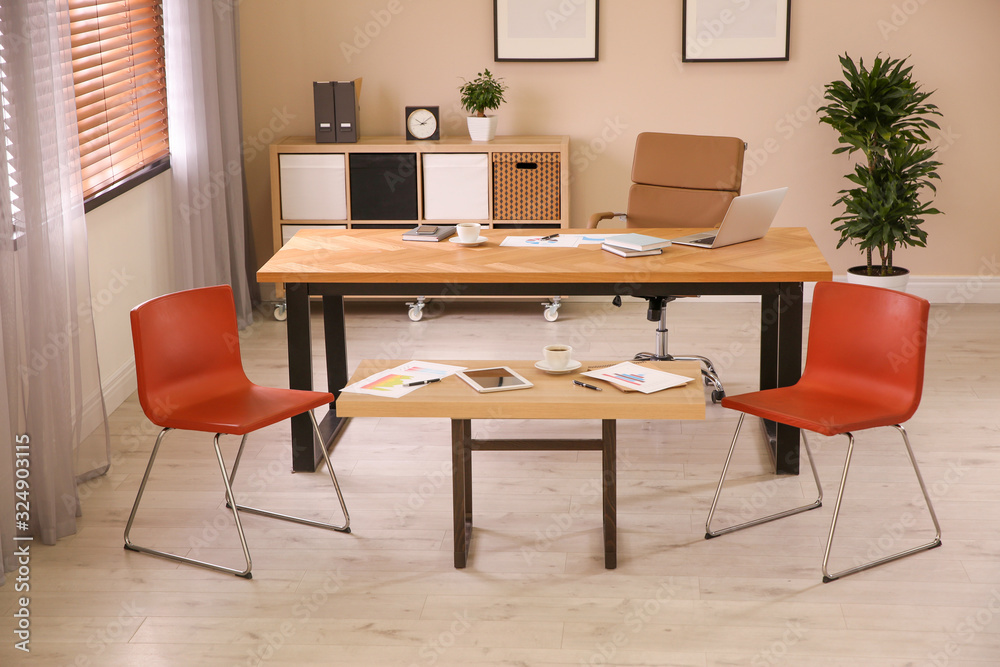 Director's office with large wooden table. Interior design