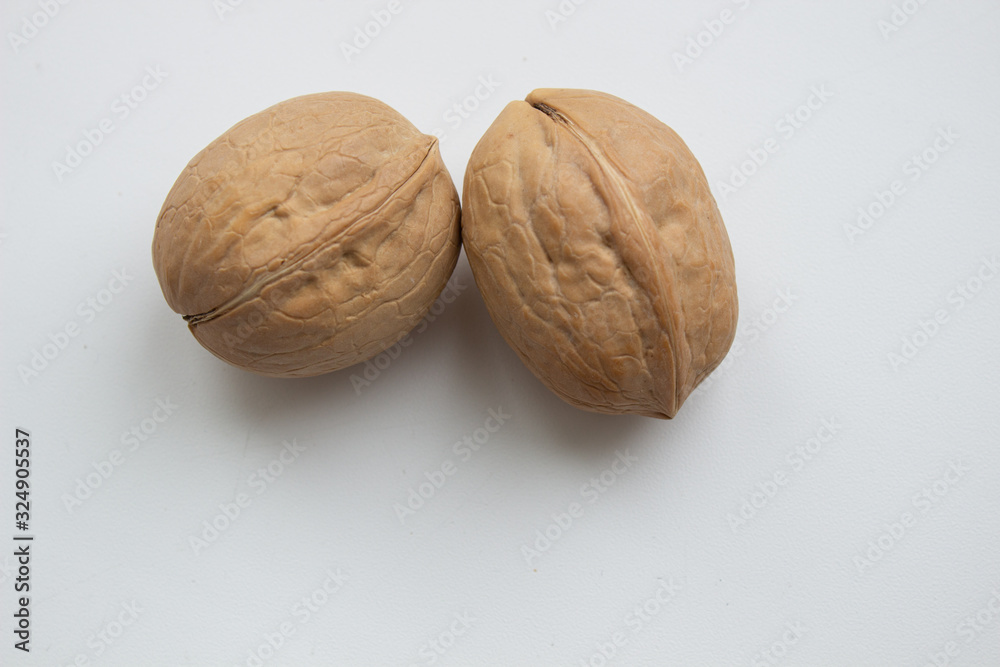 Walnut close - up isolated on a white background. Walnut close - up isolated on a white background.