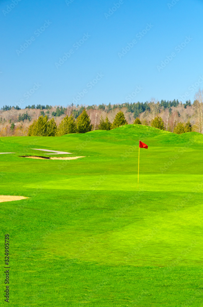 Obraz premium Golf place with gorgeous green and sand bunker.