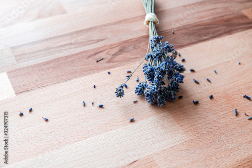 Dried lavender on rustic wooden table.