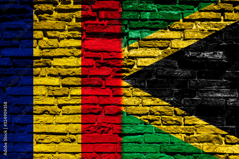 Flag of Chad and Jamaica on the brick wall