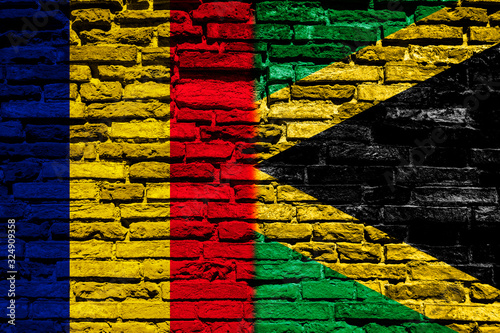 Flag of Chad and Jamaica on the brick wall