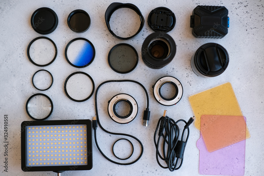 Flat lay composition with equipment for professional photographer on grey background. Flat lay composition with equipment for professional photographer on grey background.
