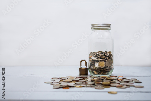 Coin money stack and lock with space for text background. Saving and financial security concept.