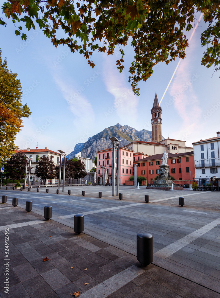 Incredible evening scene in Lecco town on Como lake, during sunset. Amazing colorful cityscape under bright sunlight. Best popular placec for travel. wonderful Autumn nature scenery. Beauty in world.