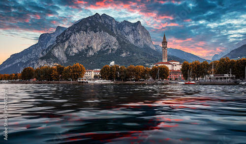 Wonderful sunset over the Lecco town. Italy, Europe. Fantastic summer sunrise on Como lake with colorful dramatic sky. Amazing nature scenery. Best popular places for travel. landscape cityscape view
