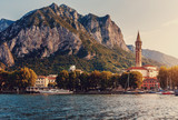Fabulous sunset over the Lecco town. Italy, Europe. Fantastic summer sunrise on Como lake with colorful dramatic sky. Amazing nature scenery. Best popular places for travel. landscape cityscape view