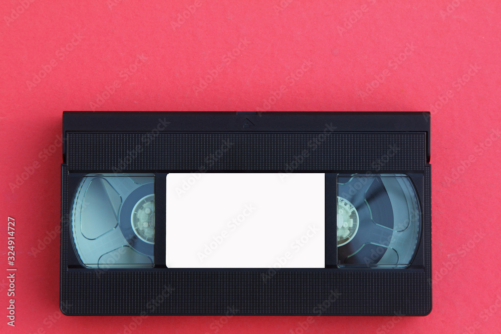 Stack of VHS video tapes as background. Old video cassette tapes. Retro technology. Stack of VHS video tapes as background. Old video cassette tapes. Retro technology.