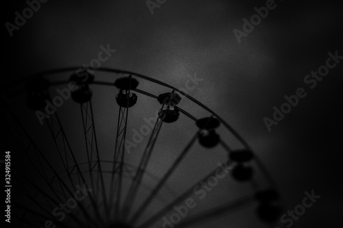 Minimal black texture background with funfair and sky