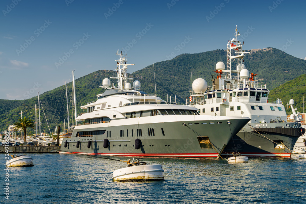 Sunny view of luxury yacht at the port of Tivat, Montenegro.