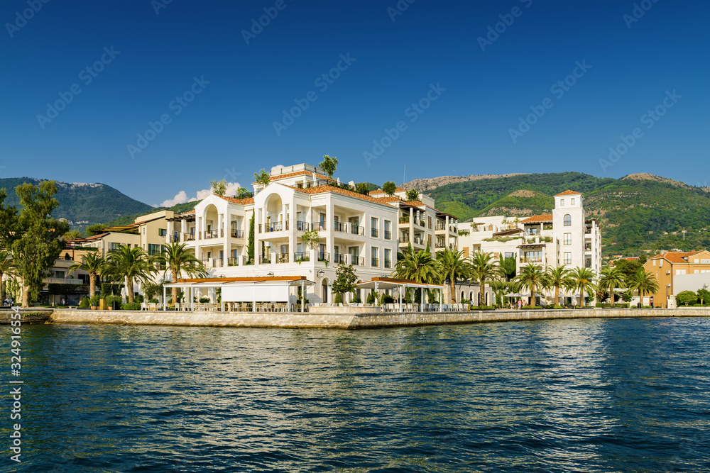 Sunny view of luxury apartments at the port of Tivat, Montenegro.