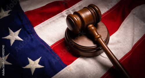 Фотография Judges gavel and an American flag -justice theme